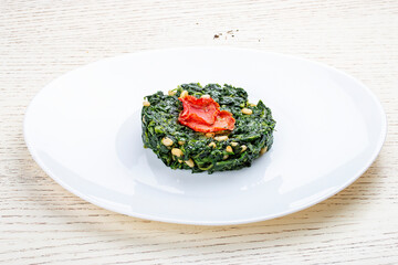 Spinach stew with pine nuts. Exquisite side dish.