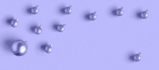 Very Peri Color of the year 2022. Violet. Purple Christmas decoration ball inside round frame of glitter balls. Flat Lay, Top View