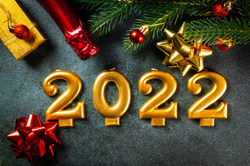 2022 numbers with champagne bottle and decor. Happy new year and festive concept. Top horizontal view copyspace. New Year Flatly. Christmas flatlay. New year 2022. New year concept.