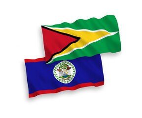 National vector fabric wave flags of Co-operative Republic of Guyana and Belize isolated on white background. 1 to 2 proportion.