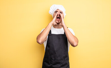 chef man feeling happy,giving a big shout out with hands next to mouth