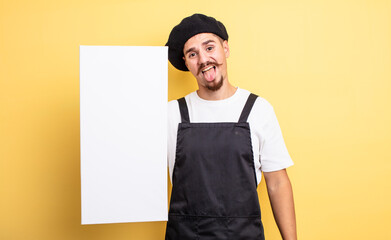 artist man with cheerful and rebellious attitude, joking and sticking tongue out. copy space concept