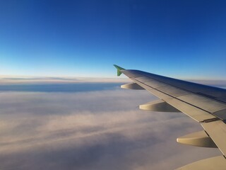 Obraz premium The plane flies among the clouds