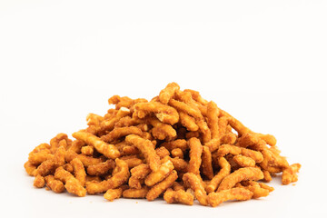 Makar Sankranti Gajak Or Lohri Mithai Jaggery Sticks Also Known As Gud ki Sev, Gur Pare Or Para made with Gram Flour Besan, Desi Ghee And Ajwain. Isolated On White Background With Copy Space