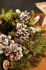 Beautiful Christmas fir crown decoration made of natural accessories like dried fruits. Amazing...