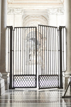 Open iron gate in a church