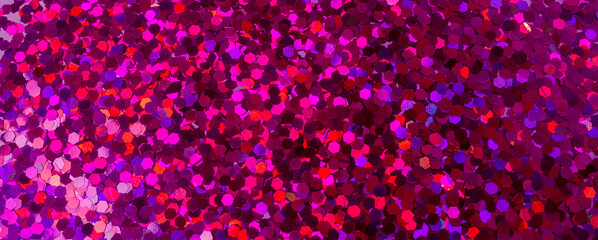 Pink, purple, violet, red sequins texture close up. Abstract background. Festive concept. Bright...