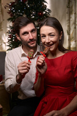 Happy couple in love enjoying dessert on Christmas eve
