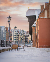 Amazing view of the snow-covered Gdańsk Crane in the morning in winter.