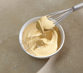 bowl of whipped instant coffee with sugar and water