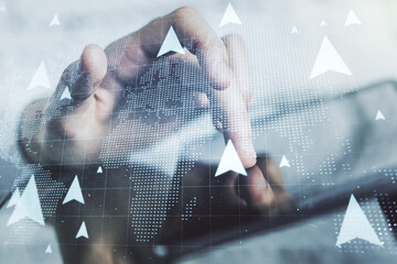 Creative concept of geolocations map and finger clicks on a digital tablet on background. GPS...