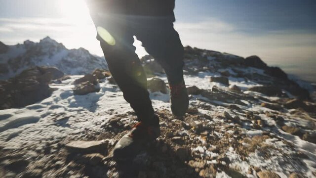 Man running at the mountain with snow