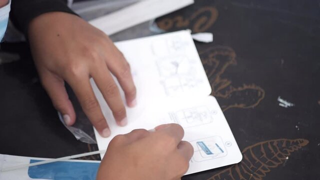 Slow motion scene of Asian students check ATK 