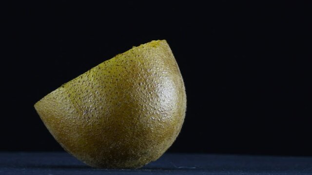 One half of kiwi fruit on rotating plate