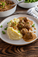 Swedish meatballs with gravy and mashed potatoes on a plate