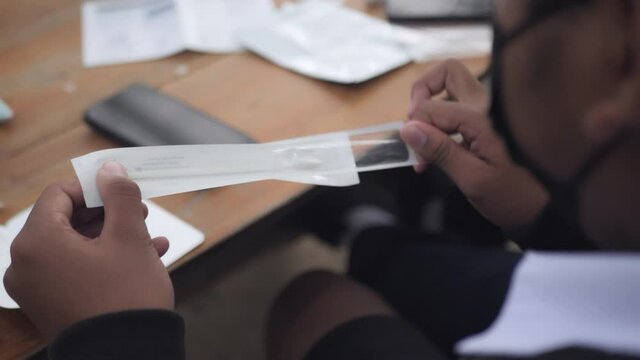 Slow motion scene of Asian students check ATK 