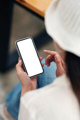 Smartphone mockup. Closeup of woman using mobile phone with empty screen at co-workspace.