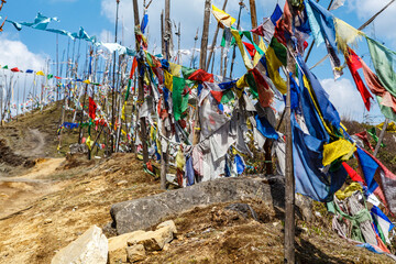 Prayer flags on top of the mountain at Chelela point in central Bhutan, Asia