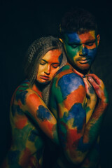 beautiful couple painted with multi-colored paints. art. love