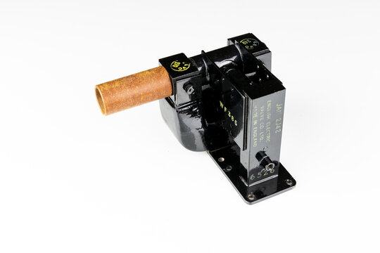 Cavity magnetron tube from English Electric Valve Co (type 2J42) on a white background - high voltage vacuum tube that generates microwaves for Radar applications