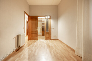 Empty room with walk-in closet at the back