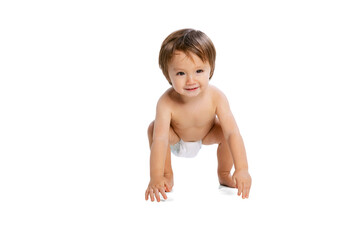 Portrait of little boy, baby, child in diaper posing isolated over white studio background. Childhood concept