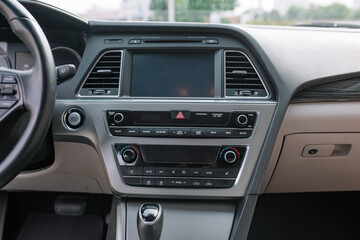 Obraz na płótnie Canvas Gray Interior Details. Media system in the car
