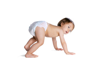 Portrait of little boy, baby, child in diaper crawls isolated over white studio background. Childhood concept