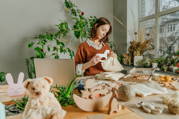 Young woman packing purchase for the buyer at eco friendly package