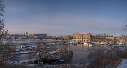 Panorama view over the bay Strömmen with piers for commuting boats, the royal castle and art...