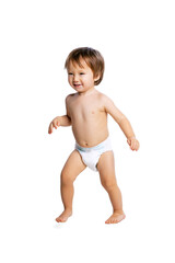 Portrait of little boy, baby, child in diaper running isolated over white studio background. Childhood concept