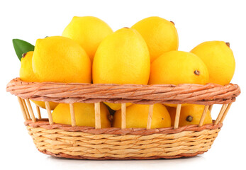 Lemons in basket isolated on white