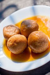 sugar filled roll, commonly known as "Rasgulla" or " Nolen Gurer Rosogolla" in Bengali is made of new Jaggery and Curd. 