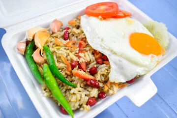 Tea leaf and rice salad called laphet htamin. Favorite street food in Asia, Myanmar.
