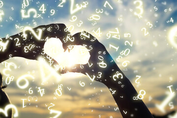 numerology, a young girl folded her hands in the shape of a heart against the background of the sun at sunset, surrounded by numbers