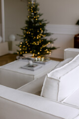 White pillow on the sofa in the background Christmas tree