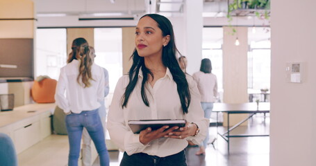 4k video footage of a cheerful young businesswoman walking through her office