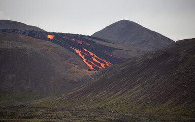 lava flow behind people