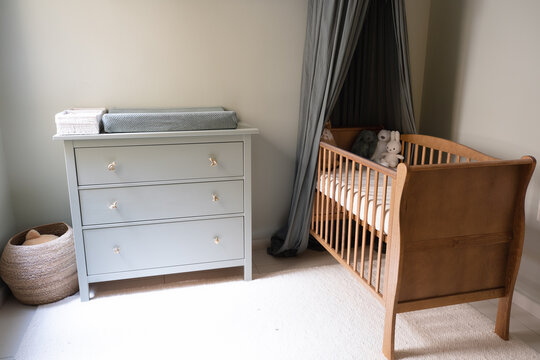 Stylish scandinavian newborn baby room with toys Modern interior with light background walls. nursery