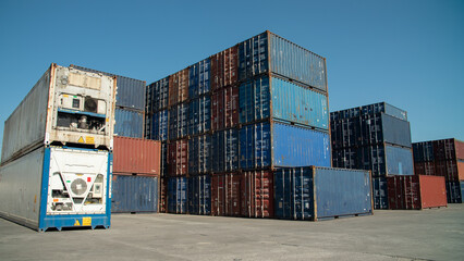 Crane lifting up container in yard