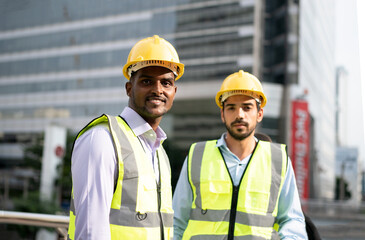 portrait of an industrial engineer against building.