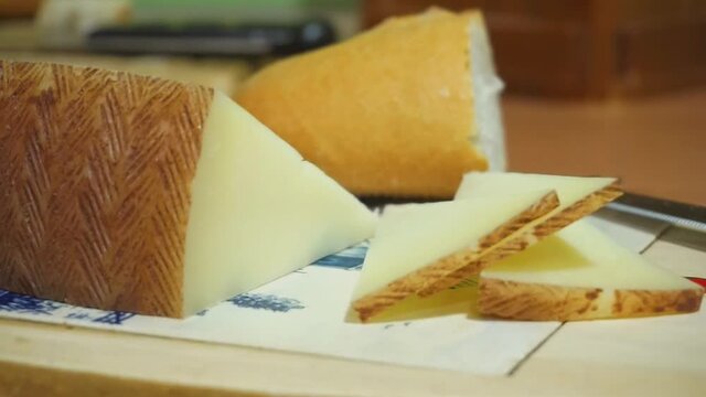 Table with Manchego cheese and bread. Traveling shot. Natural food