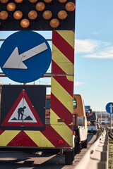 Public road work and closure sign.