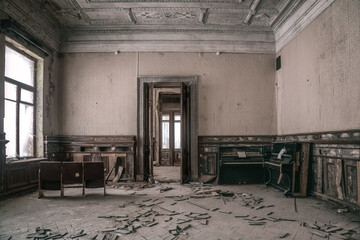 A beautiful old room in an abandoned building. Light from the windows. Beautiful doorway. Shabby...