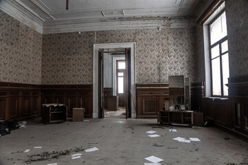 A beautiful old room in an abandoned building. Light from the windows. Beautiful doorway. Shabby...