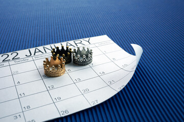 Epiphany Day Concept. 6 January calendar with three crowns on bue background