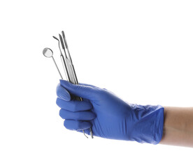 Dentist holding set of tools on white background, closeup