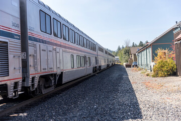Train cars lined up on the tracks at a rural stop in Truckee California