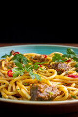 Peruvian pasta with meat cut with knife