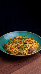 Peruvian pasta with meat cut with knife